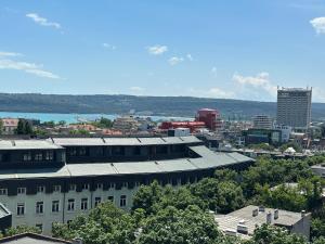 a view of a city with a white building at Guest Rooms Boutique Varna in Varna City