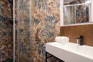 a bathroom with a sink and a shower at Marghera Venice Link Rooms in Venice