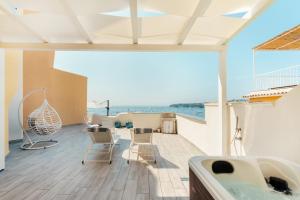 a living room with a view of the ocean at Stella di Mare in Procida +7 photos