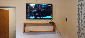 a flat screen tv hanging on a wall at El Rancho Oliva in Molinari