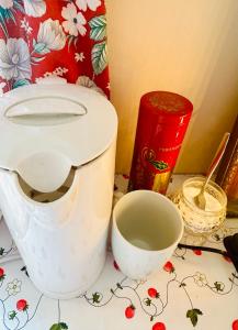 a white toilet sitting on top of a counter at Rosahuset in Kabelvåg +25 photos