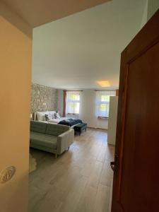 a living room with a couch and a bed at Vanellus in Balatongyörök +3 photos