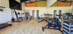 a gym with several exercise bikes in a room at Casa da Cristina 5A in Burinhosa