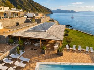 an image of a house with a solar roof at L'Ariana Resort, Glamping in Rinella
