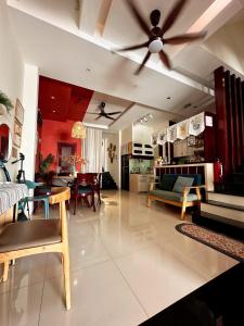 a living room with a couch and a ceiling fan at Annie.homestay 12NM in Nha Trang