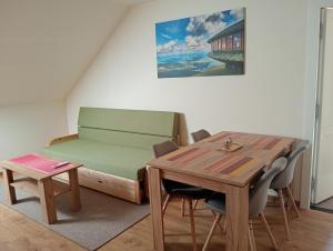 a room with a desk and a table and a bed at Apartament Miłków Karkonosze in Miłków