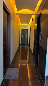 a hallway of a building with a door and a hallwayngth at Hotel Vakula Matha Grand in Tirupati