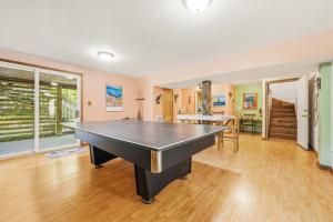 a room with a ping pong table in it at 3021 - Southern Snores in Kitty Hawk Beach