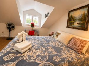 a bedroom with a large bed with a blue rug at ChinaTown Boutique Rooms in Toronto
