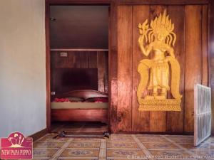 Postel nebo postele na pokoji v ubytování New Papa Pippo Resort + 21 fotografií