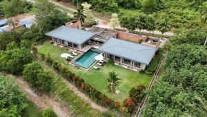 an overhead view of a house with a swimming pool at Laman Villa Port Dickson in Port Dickson