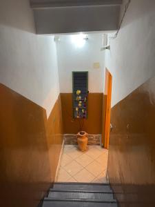 a hallway with a plant in a pot in a building at Al Duca 165 in Ladispoli