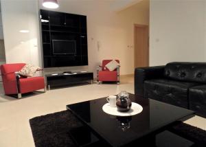 a living room with a couch and a coffee table at Lavender Bay Apartment C12 in Donji Morinj