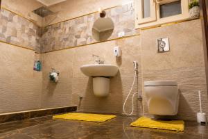 a bathroom with a toilet and a sink at Nile Pyramidal view place in Cairo +13 photos