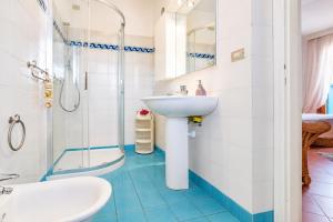 a bathroom with a sink and a shower at Casa Aldrovandi in Capoliveri
