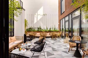 an outdoor patio with chairs and tables and windows at Zanzibar Locke in Dublin