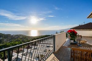 a balcony with a view of the ocean at Casa Aldrovandi in Capoliveri