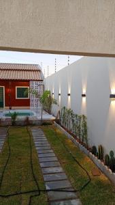 a house with a garden with plants on the side of it at Solar da Colina in Petrolina
