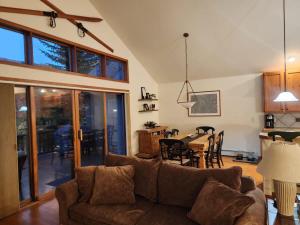a living room with a couch and a table at Townhome 4BR/4BA in Silverthorne in Silverthorne