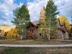 a house with trees in front of it at Townhome 4BR/4BA in Silverthorne in Silverthorne