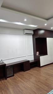 a large room with a large white wall at 05 Homestay Cinema in An Khê