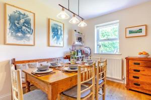 a dining room with a wooden table and chairs at 3 Bed in Hawes oc-ds967 in Hawes