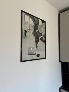 a framed picture of a baseball player on a wall at Alpine penthouse, breathtaking views! in Bussoleno