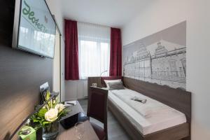 
Ein Bett oder Betten in einem Zimmer der Unterkunft Hotel Westfalia
