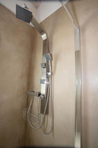a shower with a shower head in a bathroom at Casa Terry in Ronchi dei Legionari
