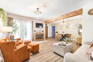 a living room with a couch and a table at Charming Farmhouse Getaway 7 Beds in Centerville