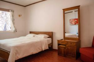Postel nebo postele na pokoji v ubytování Mount Mary Inn