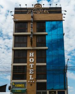 a tall building with a sign on it at El Sueño Del Rey in Majes