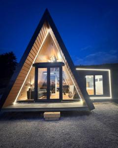a house with a large window in the front of it at View Retreat in Visoko +5 photos