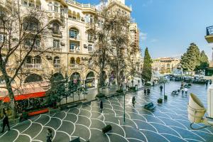 a view of a street in a city with a building at Kolorit Modern Apartment in Baku