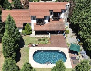 an aerial view of a house with a swimming pool at MyHomeSapanca in Sapanca