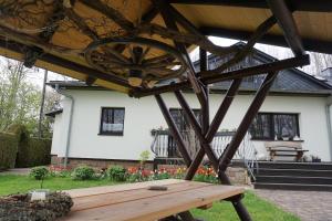 a wooden bench in front of a house at Live your dream in Kirchberg +9 photos