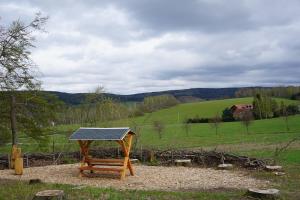 a solarvisor on a picnic table in a field at Live your dream in Kirchberg