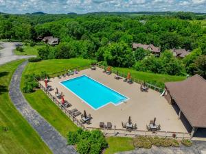 an aerial view of a swimming pool in a yard at King Bed Fire Pit Pool & Walk to North Course in Galena