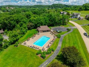 an aerial view of an estate with a swimming pool at King Bed Fire Pit Pool & Walk to North Course in Galena