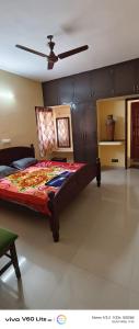 a bedroom with a large bed in a room at Sky park homestay in Yercaud