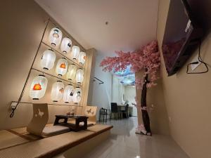 a store with a display of shoes in a room at Ipoh Town Hotel by Serenity in Ipoh