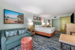 a hotel room with a bed and a couch at Bluegreen Vacations Hammocks at Marathon, Ascend Collection Resort in Marathon +82 photos