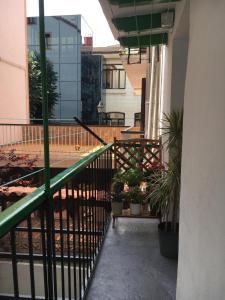 a balcony of a building with potted plants on it at Earra - Salegi - 2 minutos playa in Zarautz