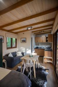 a living room with a couch and a table at Tagua Cabins Malalcahuello in Malalcahuello