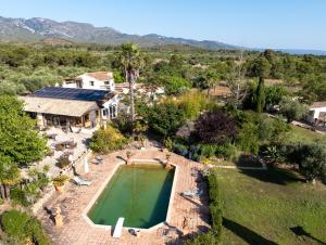 an aerial view of a house with a swimming pool at Ecolodge Carpe Diem El Perelló in Perelló