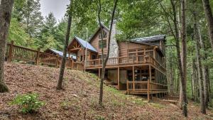 a log cabin in the woods with trees at Among the Trees in Epworth