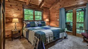 a bedroom with a bed in a log cabin at Among the Trees in Epworth