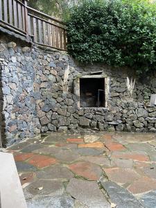 a stone wall with a hole in it at Arelauquen Bungalows & Suites in San Carlos de Bariloche