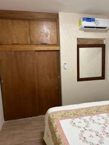 a bedroom with a closet and a bed and a door at Excente alojamiento in Zaragoza