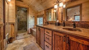 a bathroom with two sinks and a shower at Living Waters in Blue Ridge +54 photos